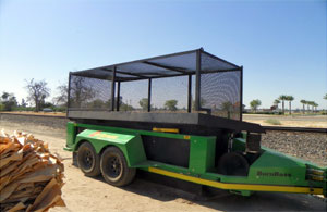 Trailer with what appears to be a screened-in cage.