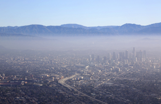 An aerial photograph of city covered with smog.