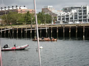 Students paddle through Boston's Inner Harbor, which is also the mouth of the Mystic River, off the Charlestown Navy yard.
