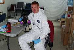 EPA researcher in personal protective equipment during a Bio-Operational Test and Evaluation exercise