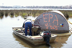 EPA assessing a tank in the water after Hurricane Katrina
