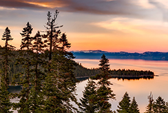 lake lined with evergreen trees