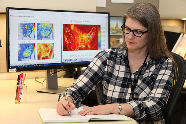 Researcher studies results from EPA’s Community Multiscale Air Quality Model (CMAQ).
