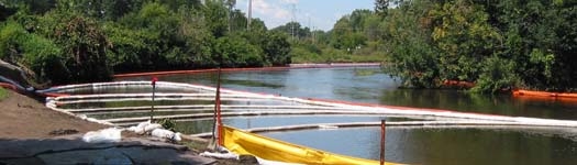 oil containment boom deployed on river