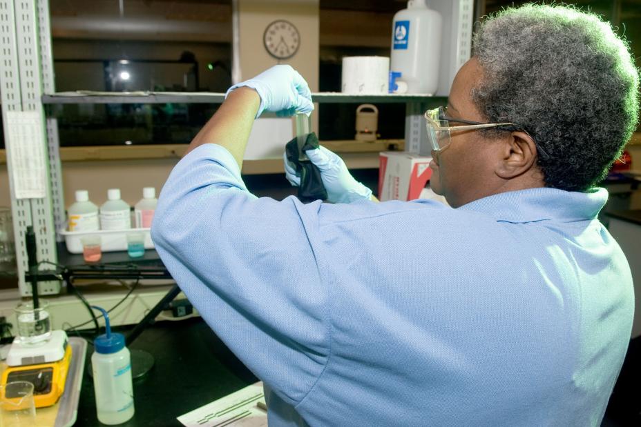 Scientist performing chemical analysis in a laboratory