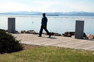Man walking along Vermont water front