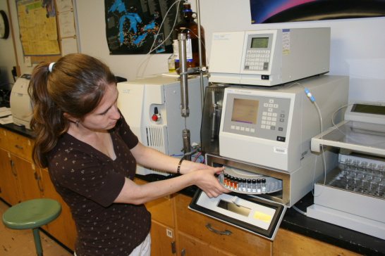 Woman working on fish contaminants in a lab