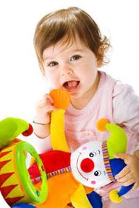 child playing with stuffed animal