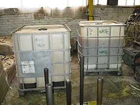 Acid waste containing totes at Brad Foote Gear Works