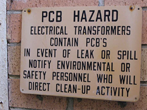 entry way sign for P and W Waste Oil warning of PCB hazard