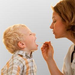 Doctor examining a child's mouth