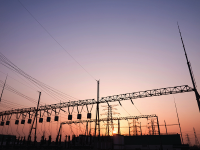 Photo: Electric supply lines in front of a setting sun