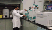 Chemist analyzing samples on liquid chromatographic/mas spectophotometer lc/ms