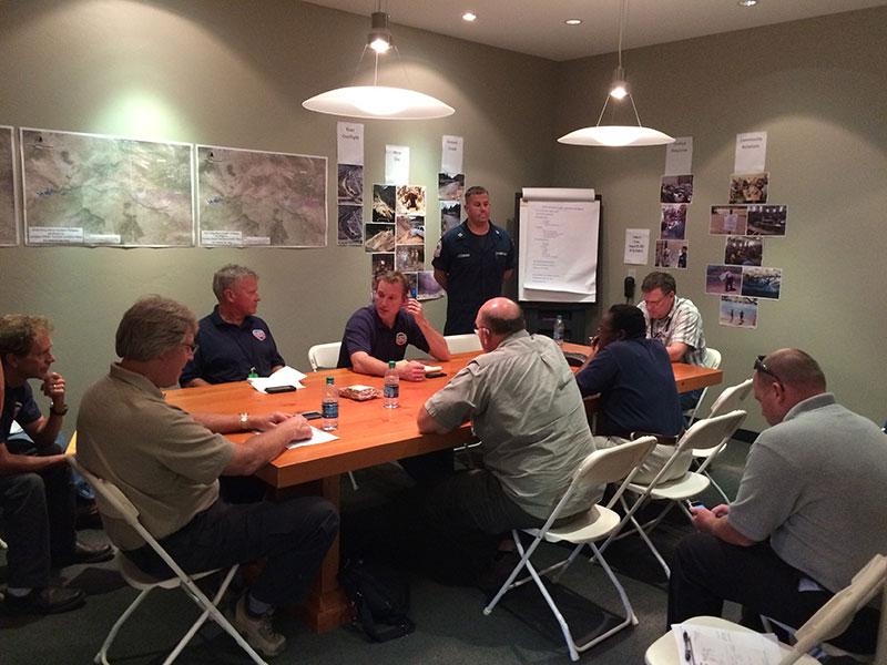 Area Command photo: Area Command staff from EPA and Coast Guard receive updates during a morning briefing