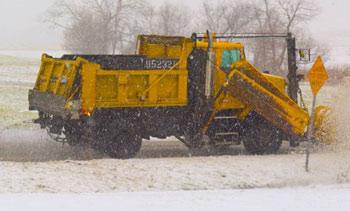 Photo of a snowplow truck that drops salt during inclement weather.