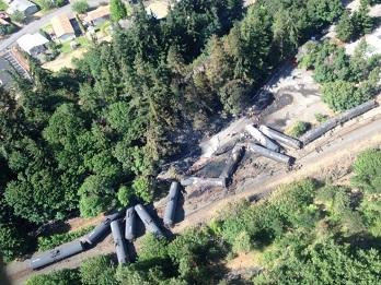 Picture of derailed train cars carrying oil.