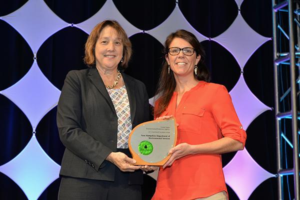 Stacey Herbold accepts Excellence Award for Education and Outreach for the New Hampshire Department of Environmental Services.