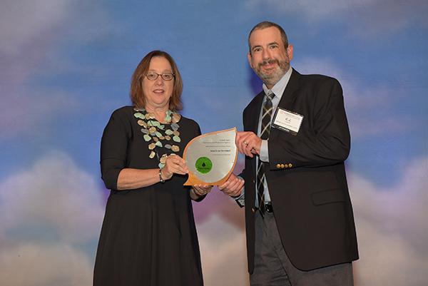C.J. Lagan accepts Excellence in Innovation and Research Award for American Standard.