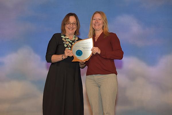 Carrie Pollard accepts Professional Certifying Organization Partner of the Year Award for Sonoma-Marin Saving Water Partnership.