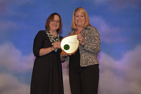 Carol Anne Kemper accepts Sustained Excellence Award for Delta Faucet Company.