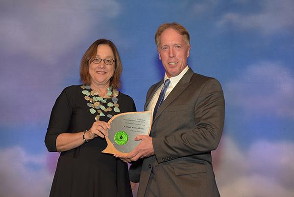 Michael Brent accepts Excellence in Strategic Collaboration Award for Cascade Water Alliance.