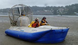 EPA researchers ride in a specially designed "hovercraft" for shoreline research at EPA’s Corvallis, Oregon lab.