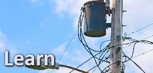 this is a picture of a transformer on a telephone pole with the word learn on it