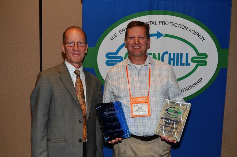 Mike Ellinger accepts Whole Foods Market's Distinguished Partner and Store Re-Certification Excellence recognitions from Tom Land of the EPA GreenChill Program