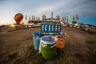 This is a picture of recycling, trash and compost bins from Electric Forest.