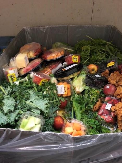This is a picture of food waste in a box at a GIANT food store