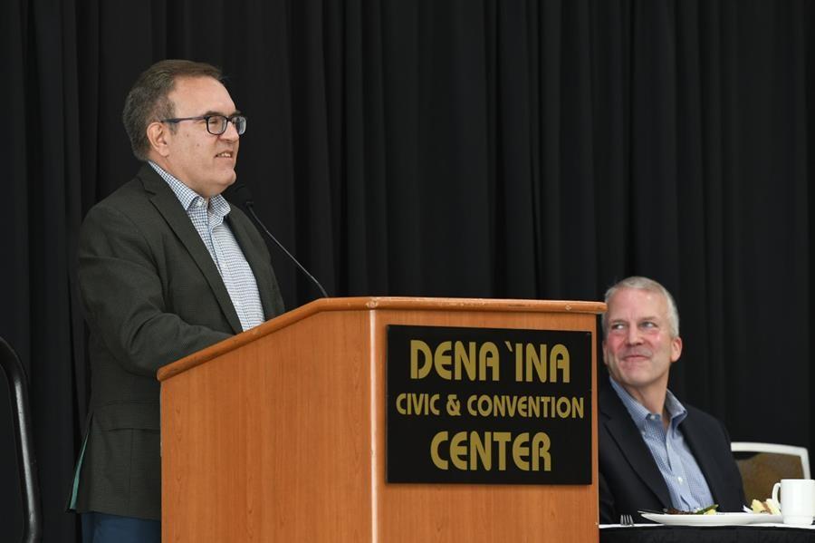 Wheeler at a podium labeled "DENA 'ING CIVIC AND CONVENTION CENTER"