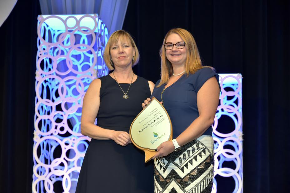 Samantha Baker accepts Promotional Partner of the Year Award for The Broward Water Partnership.