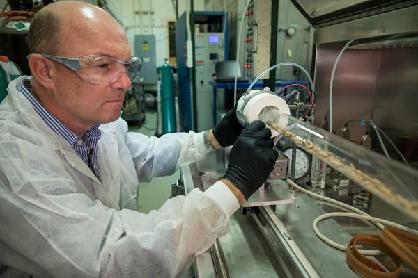 Dr. Ian Gilmour conducting an experiment using the tube furnace located at an EPA laboratory in Research Triangle Park, North Carolina. 