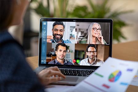 Decorative image of a diverse group of people on a video conference call with a graph.