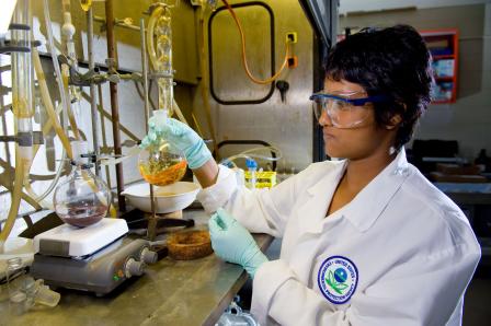 EPA lab technician wearing protective gear working in a laboratory