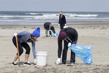 people cleaning up the beach