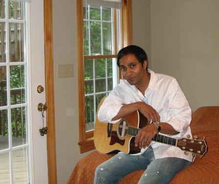 Vasu Kilaru  at home with his guitar