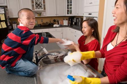 Decorative photo of family washing dishes