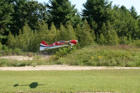 A model plane taking off at the site