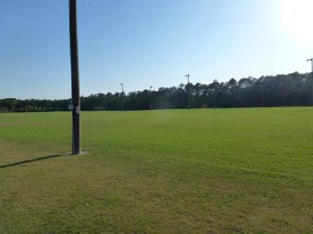 A view of the completed large, open, multi-use soccer fields on the site