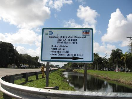 Signs for Dept. of Solid Waste Management offices at the site