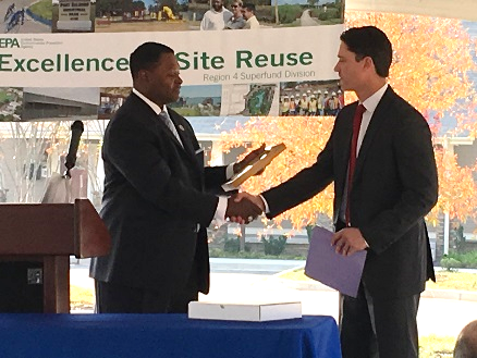 Franklin Hill, Region 4 Superfund Director presents Philip Stallman of ExxonMobil with an "Excellence in Site Reuse" Award.