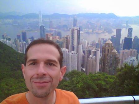 Vito in a selfie with the city of Hong Kong behind him. 