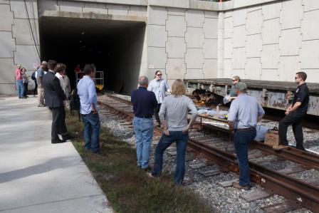 Dr. Taft demonstrating sample collection methods used in the OTD to a tour group during VIP day.