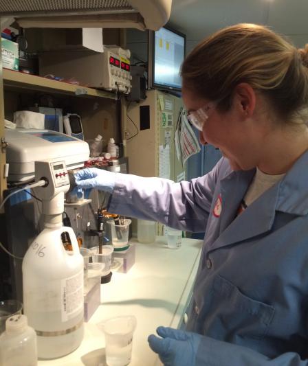 Scientist performing board chemistry analyses onboard the R/V Lake Guardian