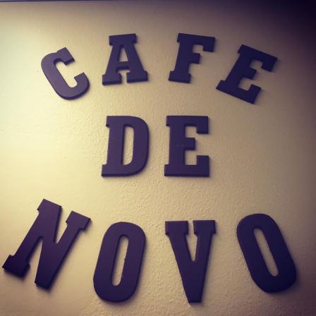 This is a picture of a sign that says Cafe de Novo