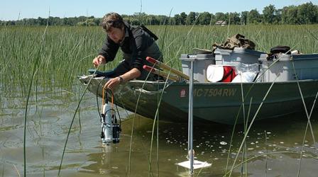 Coastal Wetland Monitoring Program scientist monitoring for water quality. 