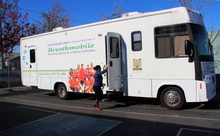 Photo of the Breathmobile, a mobile asthma clinic in a white Recreational Vehicle.