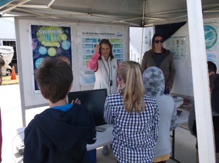 EPA’s Cheryl Hankins and Beth Moso talk with students about the fate of plastics and other recyclable trash in the environment.