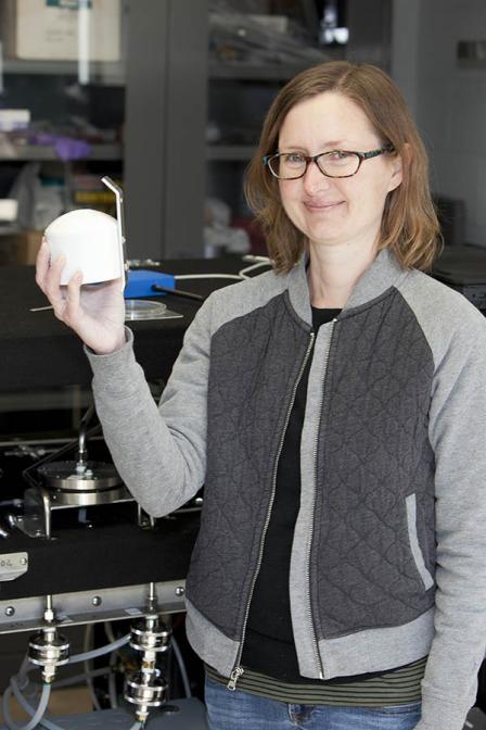 EPA scientist Amara Holder holds up the sensor. 